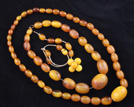 Two graduated amber bead necklaces and a brooch, longest 20in.